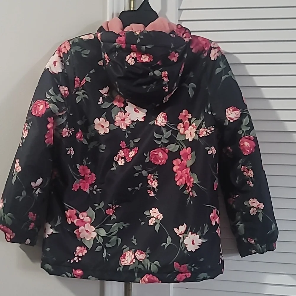The Children's Place Black Hooded Floral Puffer Jacket with Pink Lining.